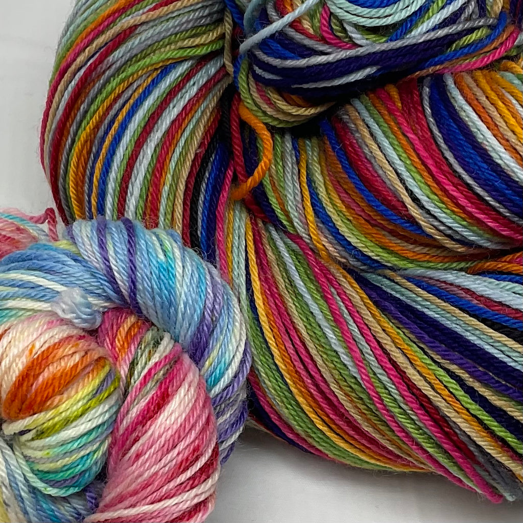 Rainbow Pantsuits Twelve Stripe Self Striping Yarn with Coordinating Speckled Mini Skein