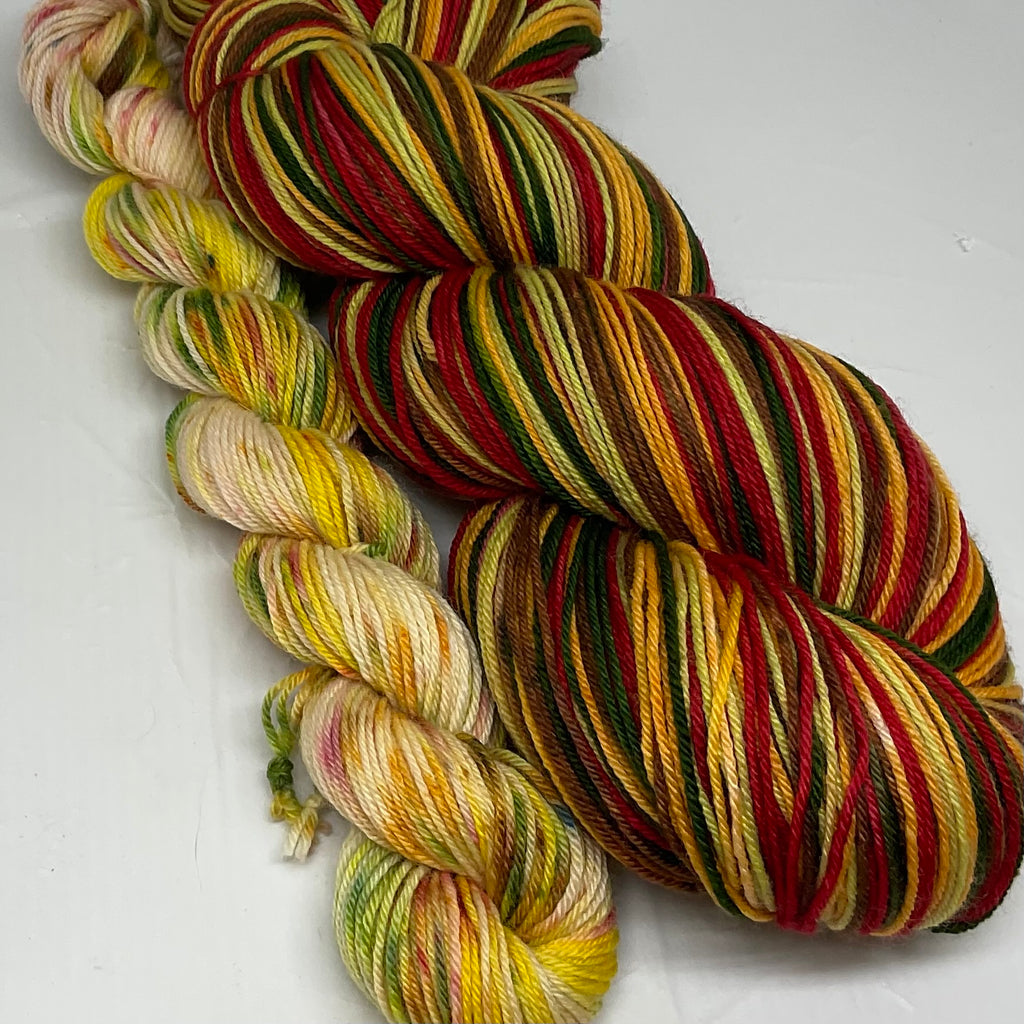 Holiday Mulled Wine Five Stripe Self Striping Yarn with Coordinating Speckled Mini Skein