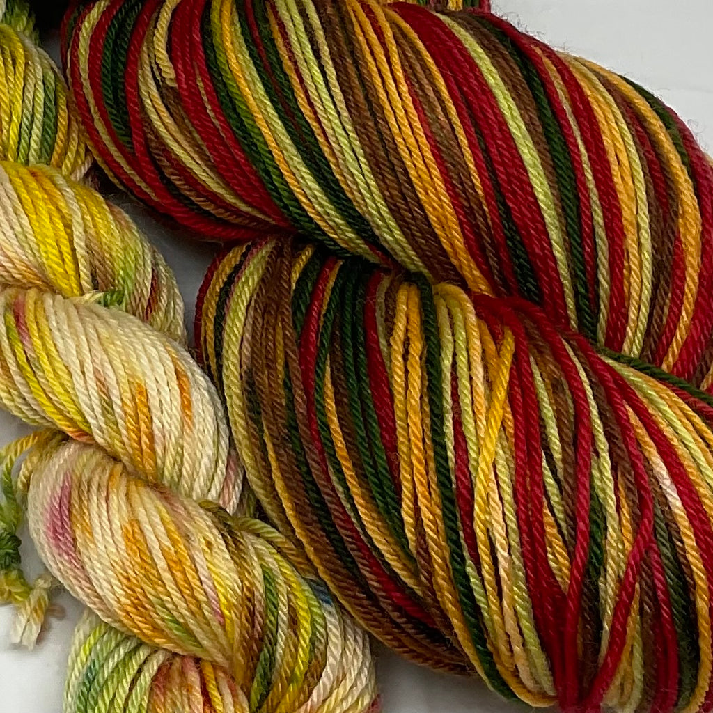 Holiday Mulled Wine Five Stripe Self Striping Yarn with Coordinating Speckled Mini Skein